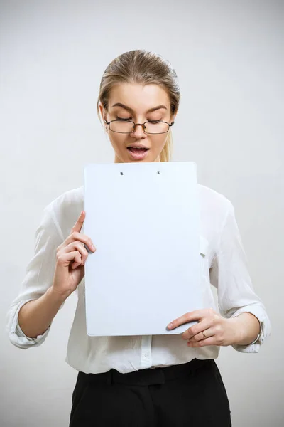 Young surprised business woman looking on folder. — Stock Photo, Image