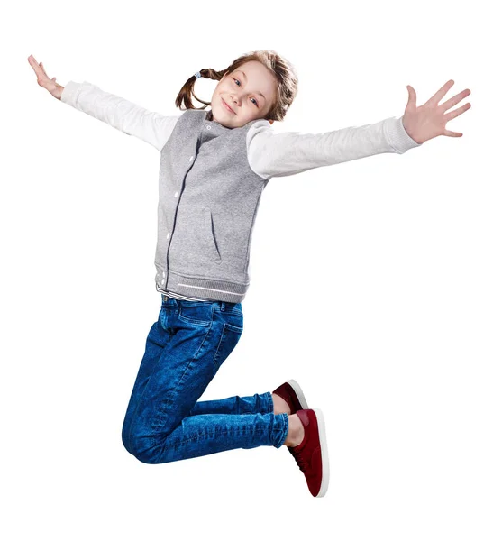 Cute smiling little girl jumping up. — Stock Photo, Image