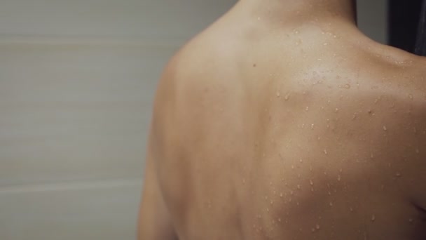 Beautiful girl washing and enjoy herself under the shower. — Stockvideo