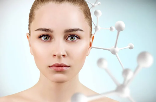 Young beautiful woman with big white molecule chain. — Stock Photo, Image