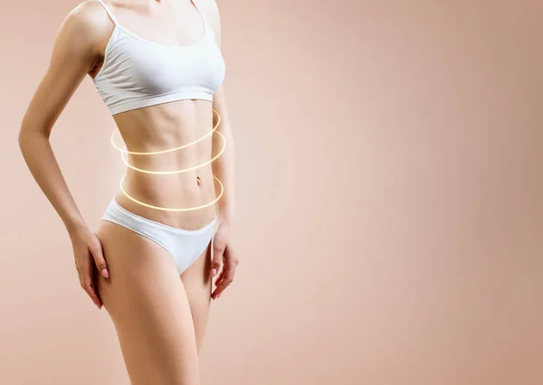 Smal kvinna kropp med glödande cirklar visar lyftande effekt. — Stockfoto