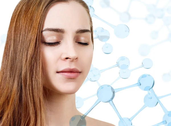 Beautiful young woman with closed eyes among blue glass molecules. — Stock Photo, Image