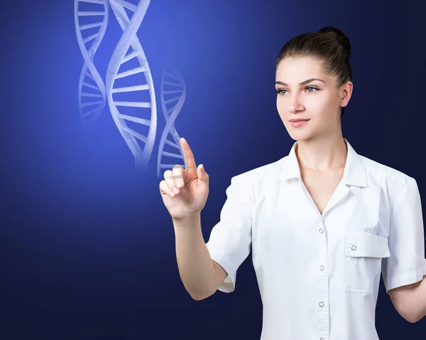 Woman science technologist touches DNA stems. — ストック写真