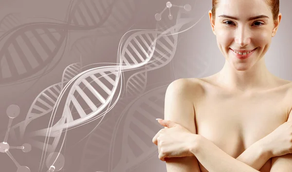 Jonge vrouw die borst met handen bedekt onder de DNA-stengels. — Stockfoto