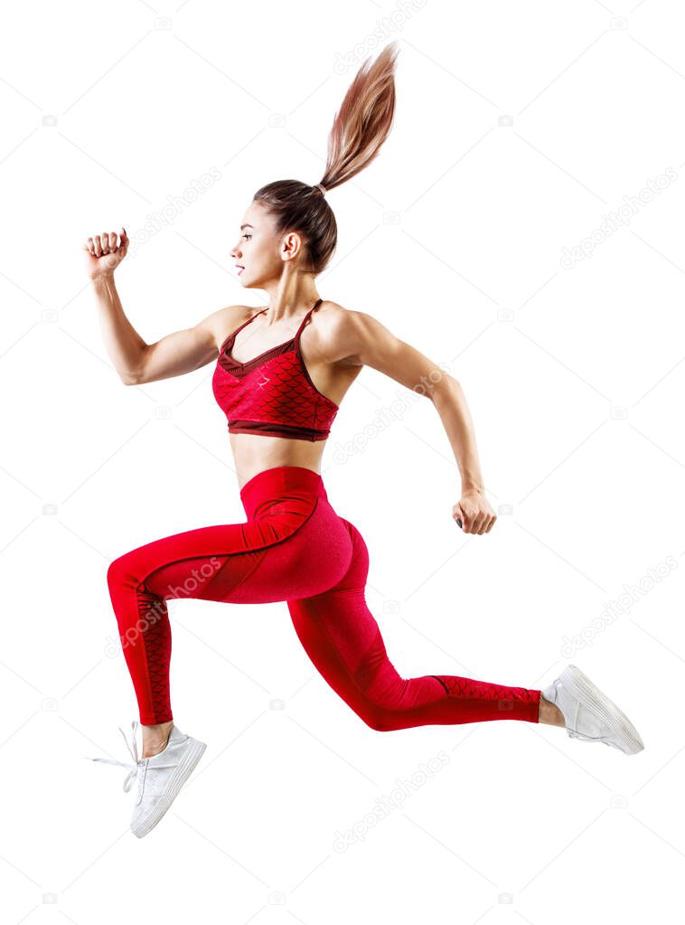 Young woman runner in red sportswear jump in the air.