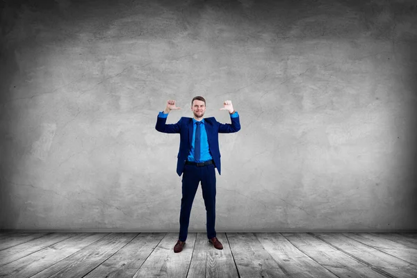 Smiling businessman pointing on himself by thumbs up gesture. — Stock Photo, Image