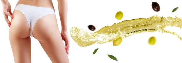 Kvinnliga skinkor nära olivolja stänk. Koncept för bantning och bantning. — Stockfoto