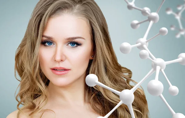 Beautiful woman near big white molecule chain. — Stock Photo, Image