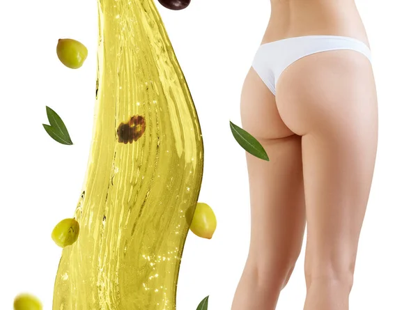 Nalgas femeninas cerca de salpicaduras de aceite de oliva. Concepto de adelgazamiento y dieta . — Foto de Stock