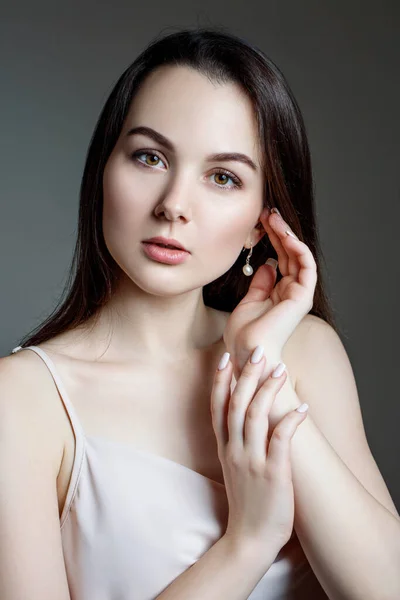 Portrait of woman in white blouse and black hair. — Stock Photo, Image