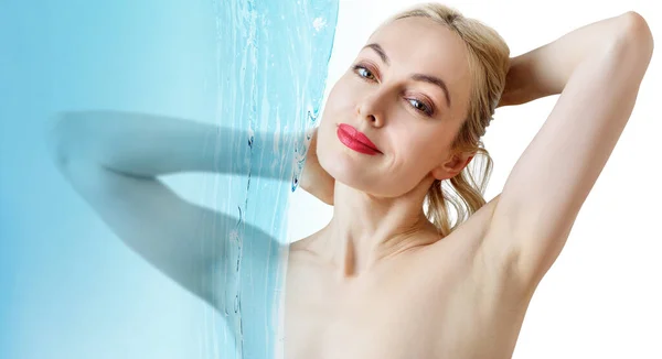 Sensual woman under water splash over white background. — Stock Photo, Image