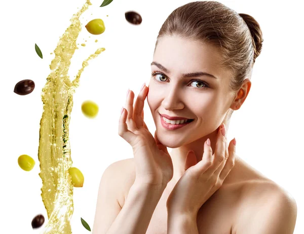 Young beautiful woman near splash olive oil. Royalty Free Stock Photos