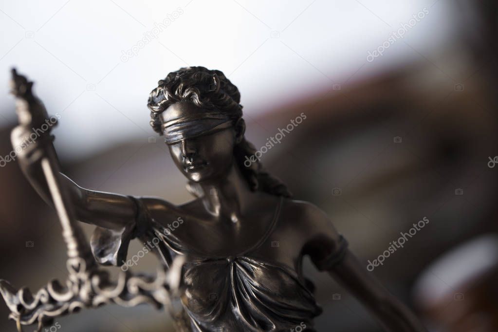 Justice concept. Statue of justice  Themis in the judge office.