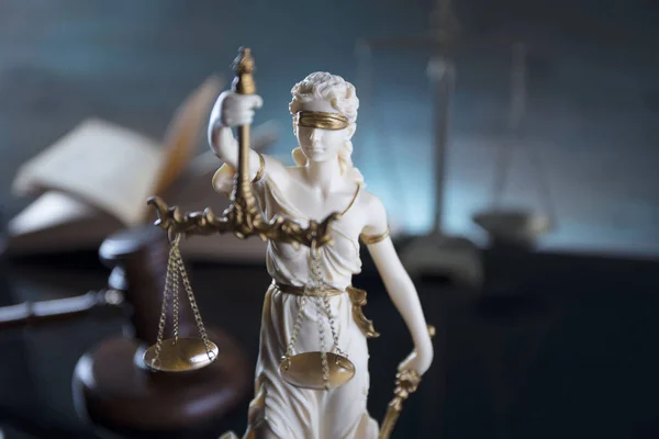 Justice concept. Statue of justice  Themis in the judge office.