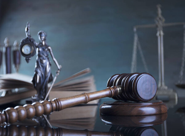 Law concept. Law symbols - Themis, judge's gavel, legal book and scale of justice.