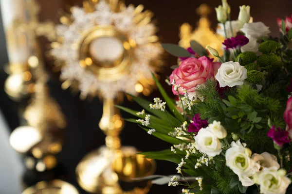 Catholic religion concept. Catholic symbols composition: The Cross, monstrance and golden chalice.