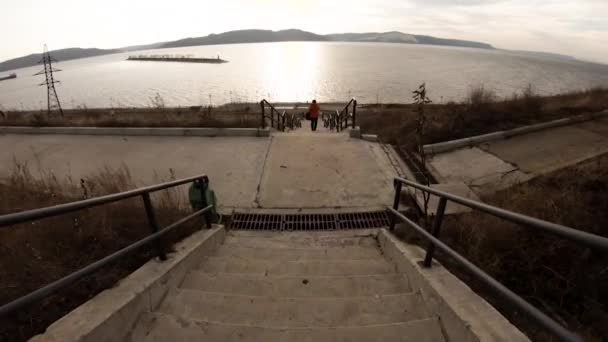 Long Staircase Descends River Girl Goes Distance Mountains Sun Shining — Stock Video