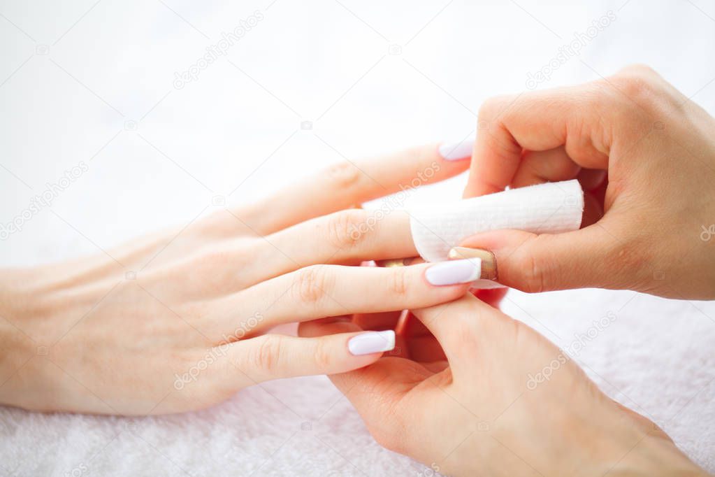 Hand and Nail Care. Beautiful Women's Hands with Perfect Manicure. Manicure Master Holding Cotton Pads in Hands. Beauty Day. Spa Manicure.