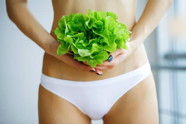 Health. Diet. Healthy Eating. Slim Woman Holding In Hands Fresh Green Salad. Young Girl in White Underwear. High Resolution