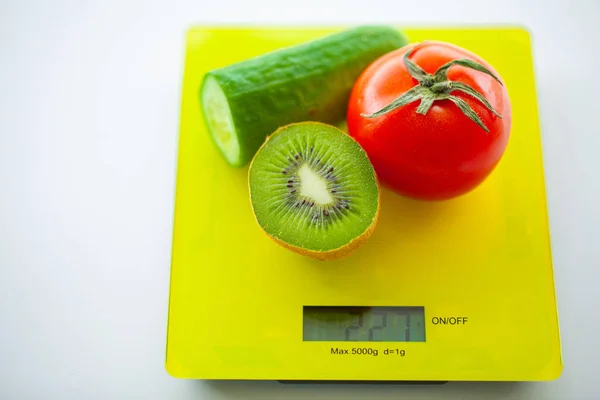 Diet or Weight Control Concept. Fruits and Vegetables With Measuring Tape On Weight Scale. Fitness and Healthy Food Diet Concept.