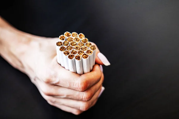Stop smoking concept on background with broken cigarettes. Heap of cigarettes. No smoking.