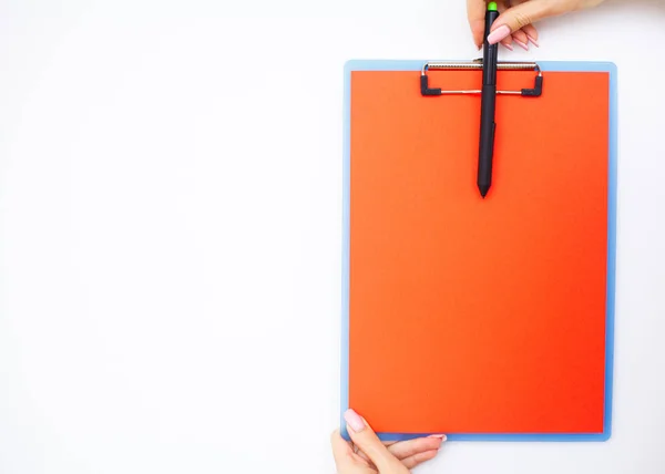 Blank Folder with Red Paper. Hand that Holding Folder and Pen on White Background. Copyspace. Place for Text.