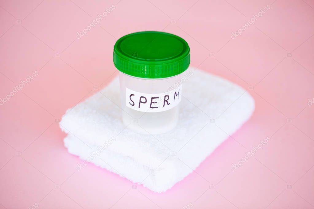 Health. Close up Sperm Analysis. Concept of Bank Sperm. Infertility Bank with Sperm on Pink Background with Towel