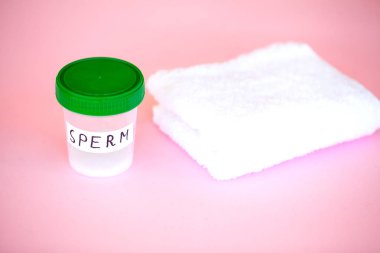 Sağlık. Sperm analizi kadar kapatın. Banka Sperm kavramı. Pembe havlu ile Sperm ile infertilite banka.