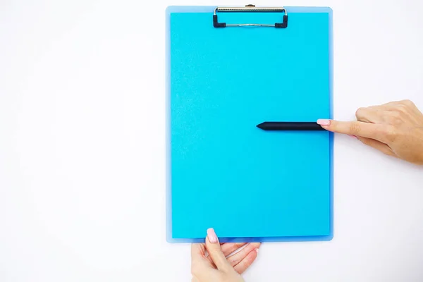 Blank Folder with Blue Paper. Hand that Holding Folder and Pen on White Background. Copyspace. Place for Text.