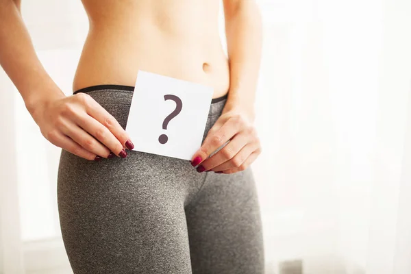 Health. Woman Body In Underwear With Question Card Near Belly