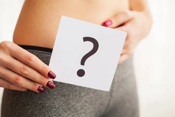 Health. Woman Body In Underwear With Question Card Near Belly