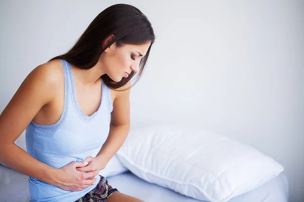 Pain stomach. Woman having painful stomachache,Female suffering from abdominal pain