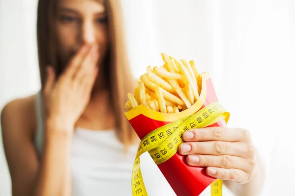 Diet. Woman Measuring Body Weight On Weighing Scale Holding Unhealthy Junk Food. Weight Loss. Obesity. Top View — Stock Photo, Image