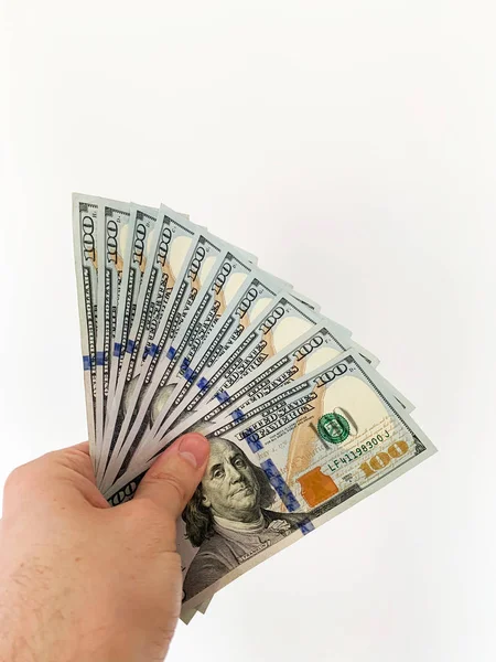 Hand holding banknote bundle of US dollar in hand — Stock Photo, Image