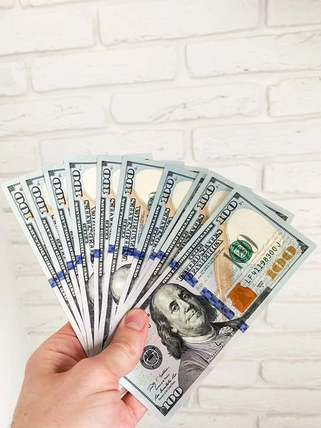 Finance money. Closeup of hand holding dollars — Stock Photo, Image