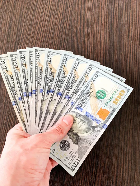 Finance money. Closeup of hand holding dollars — Stock Photo, Image