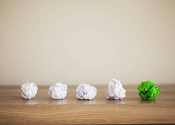 Great idea concept. Crumpled colorful paper on wooden table. Copy space