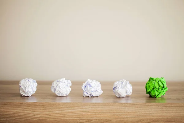 Great idea concept. Crumpled colorful paper on wooden table. Copy space