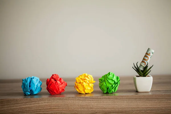 Great idea concept. Crumpled colorful paper on wooden table. Copy space