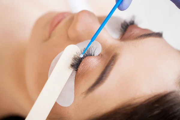 Woman Eye with Long Eyelashes. Beautiful Young Woman During Eyelash Extension — 스톡 사진