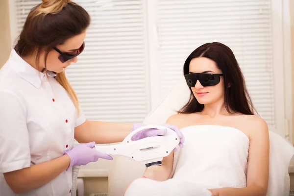 Skin care. Adult woman having laser hair removal in professional beauty salon — Stock Photo, Image