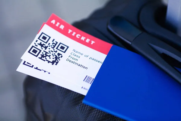 Close up two air ticket in abroad passport near airport