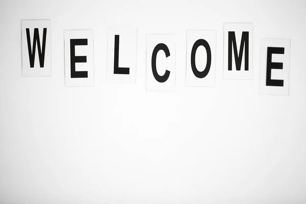 Welcome word written on white table. Copy space — Stock Photo, Image