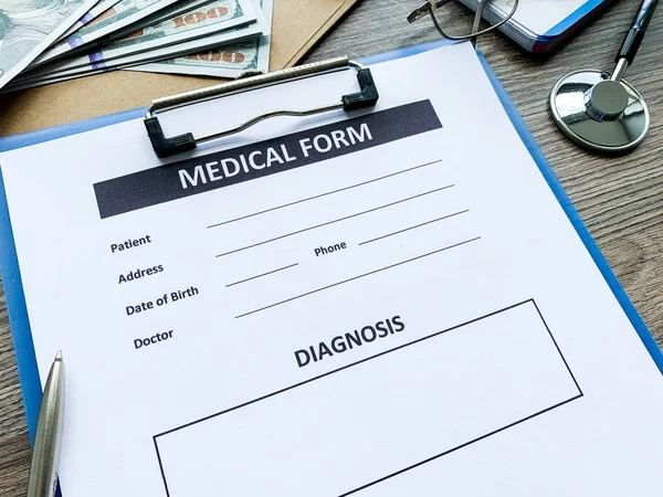 Medical form with patient data on doctors desk