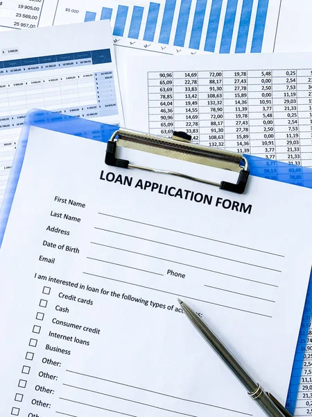 Loan application form document with graph on table Stock Image
