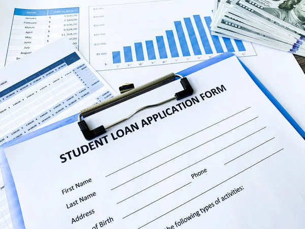 Student loan application form document on table — Stock Photo, Image