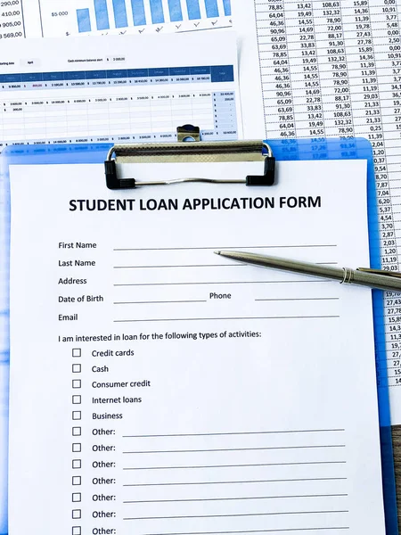 Student loan application form document on table — Stock Photo, Image