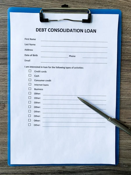 Documento de préstamo de consolidación de deuda con gráfico sobre tabla . —  Fotos de Stock