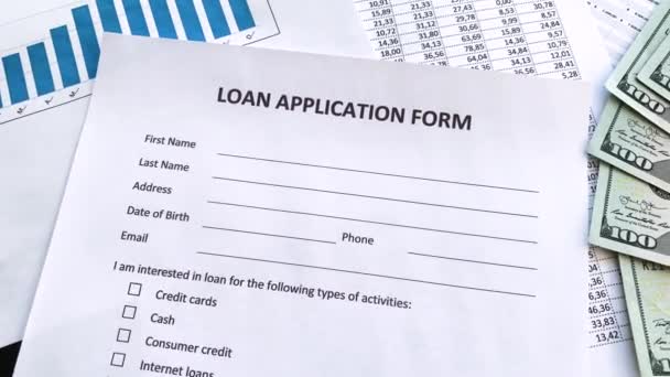 Loan application form document with graph on table — Stock Video