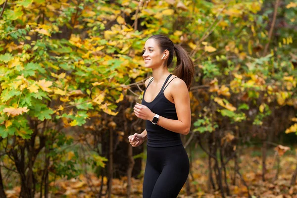 Healthy lifestyle. Woman jogging on forest trail